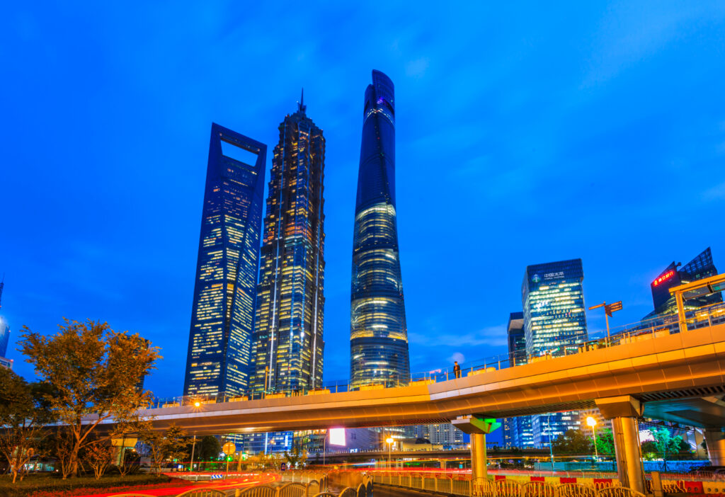 A futuristic view of Shenzhen City’s skyline with towering skyscrapers, modern architecture, and vibrant lights showcasing the city’s rapid evolution