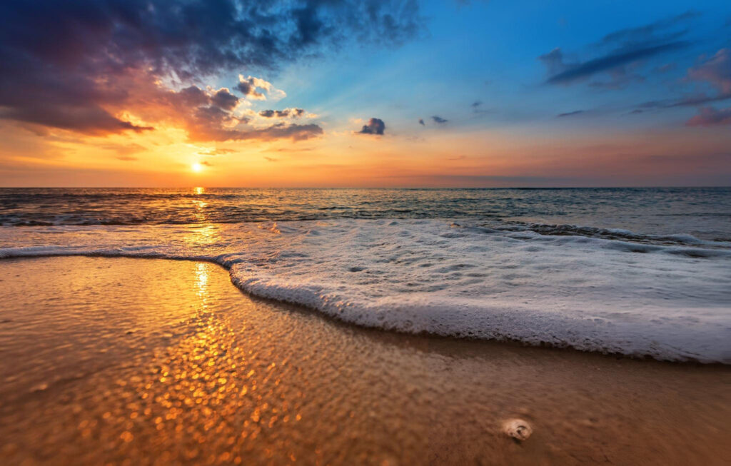 A stunning view of Durban’s golden beaches along the Indian Ocean with people enjoying the sun and surf