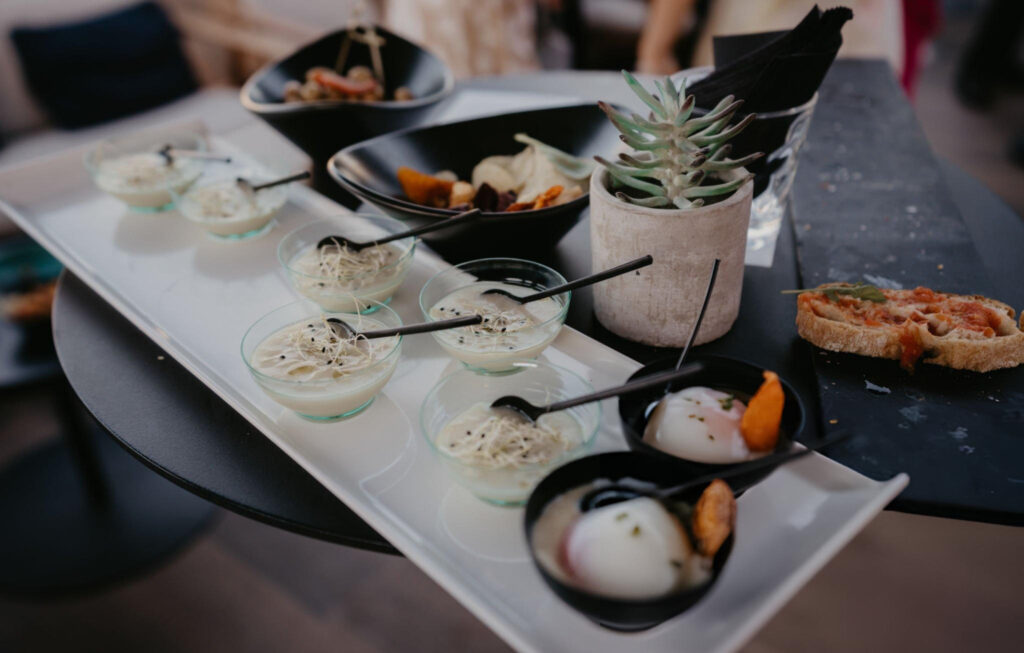 A beautifully presented plate of grilled seafood with vegetables, typical of the Mediterranean cuisine served in Bol, Croatia