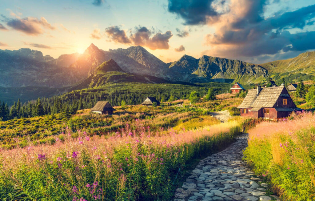 Scenic mountain landscape with a few charming houses nestled among the trees