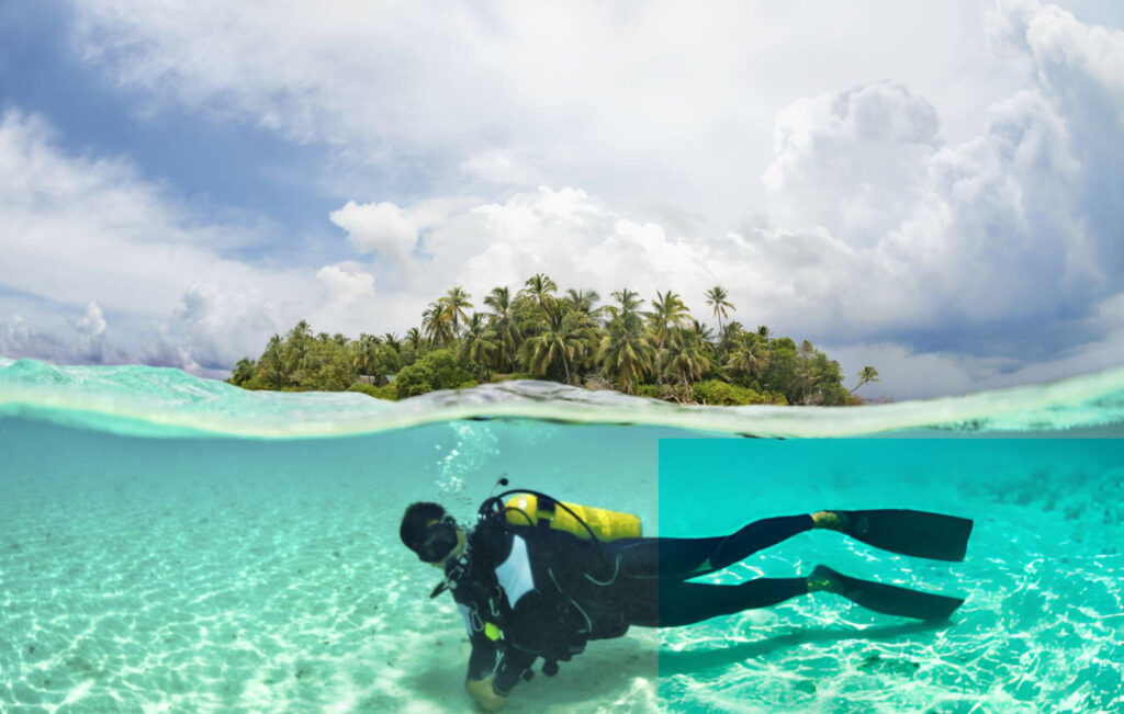 A diver exploring the vibrant coral reefs near Dhangethi Island in the Maldives, surrounded by colorful fish and marine lif