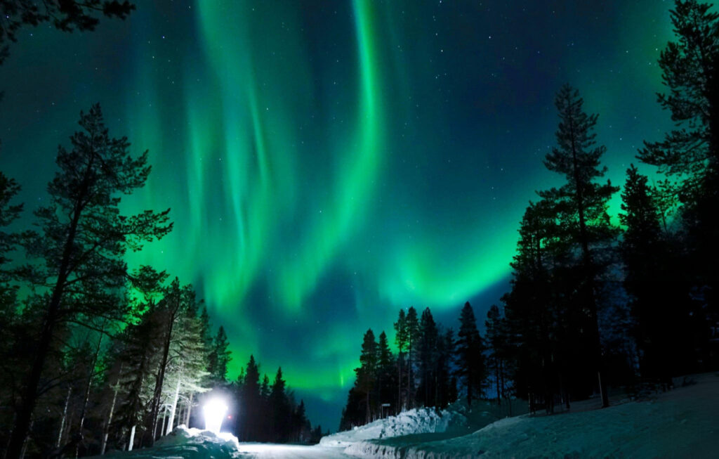 Aurora Borealis illuminating the night sky over Rovaniemi, Finland