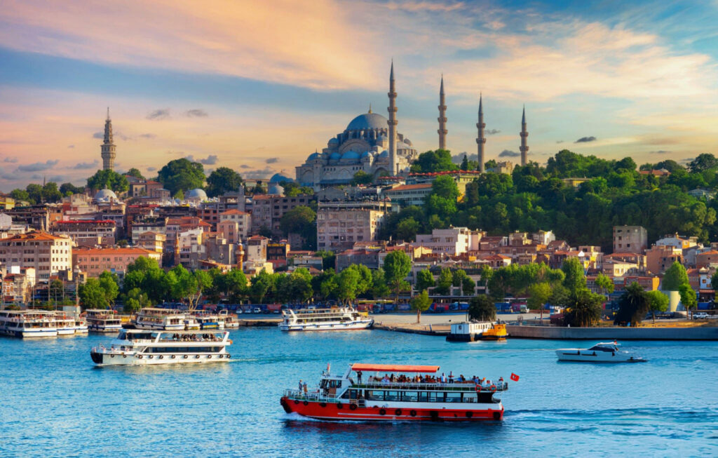 A panoramic view of Istanbul, Turkey, showcasing the city’s iconic skyline with landmarks such as the Hagia Sophia, Blue Mosque, and the Bosphorus Strait, blending historical architecture with modern cityscape