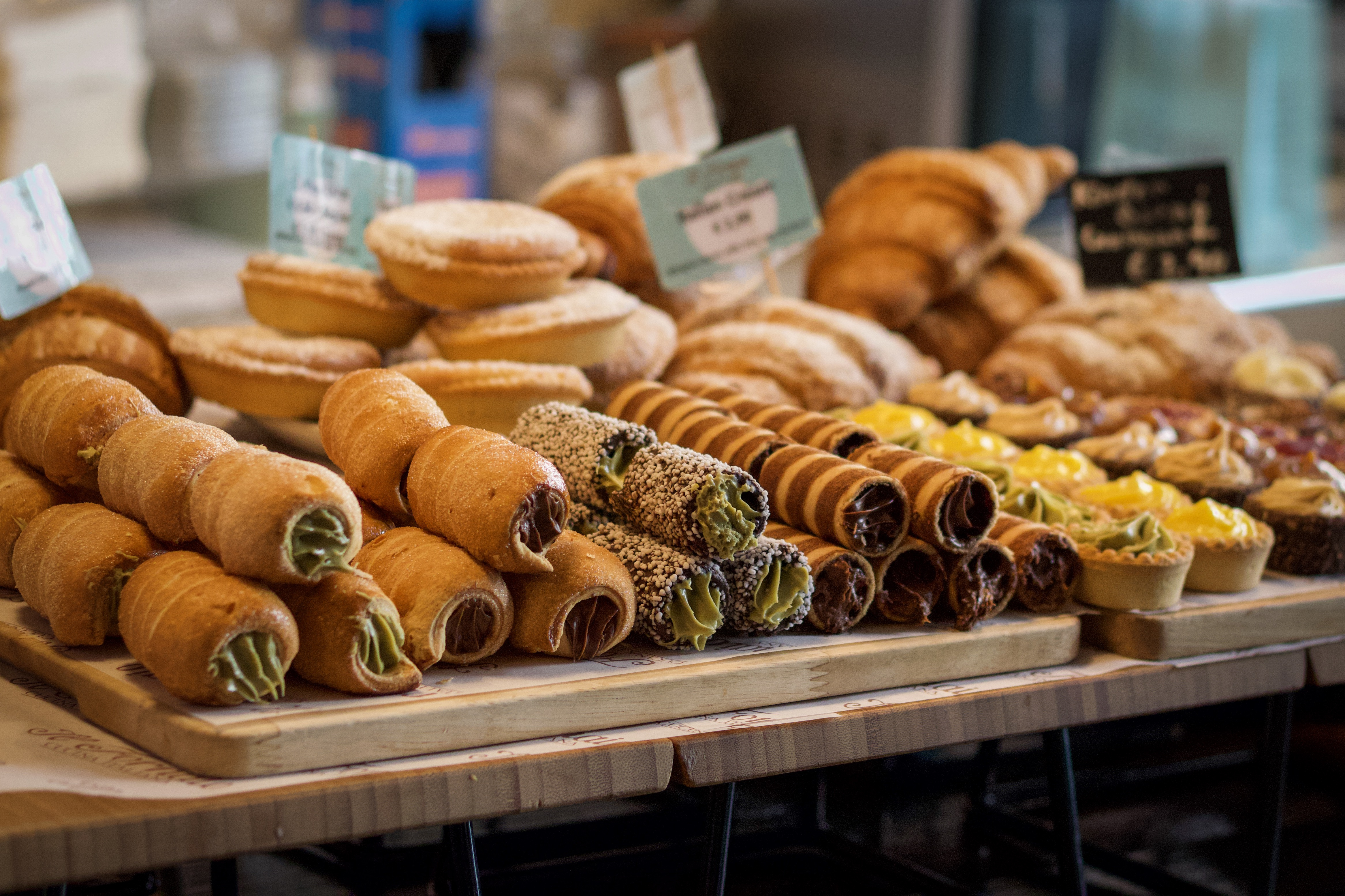 A variety of Italian cannoli and pastries beautifully arranged on a display table
