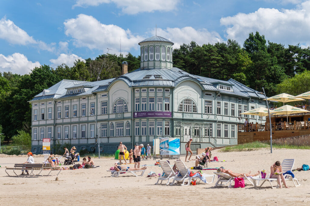 People relaxing on Jūrmala Beach, enjoying the sun and sea