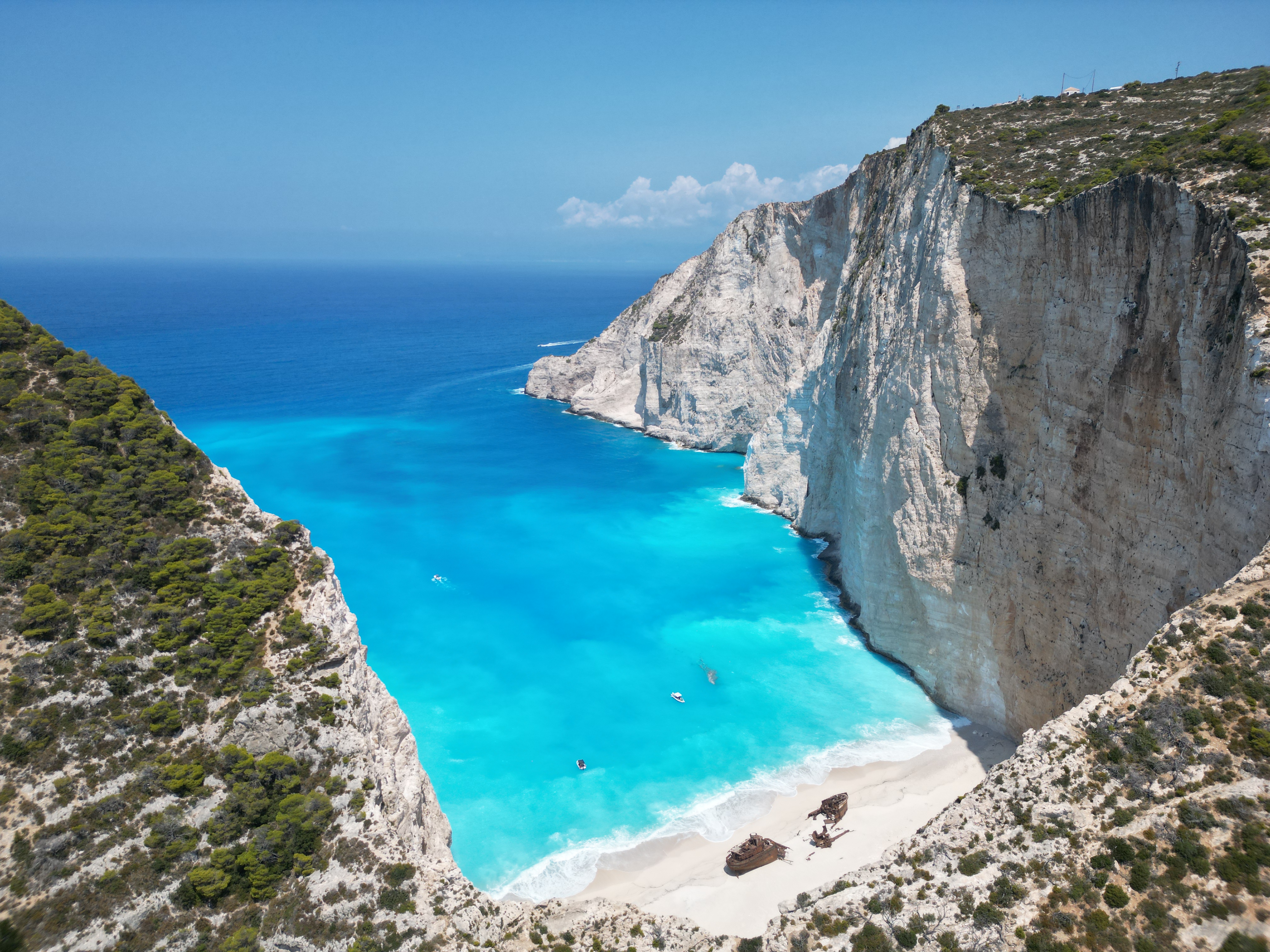 Shipwreck on Navagio Beach, Zakynthos, Greece, surrounded by white cliffs and turquoise waters
