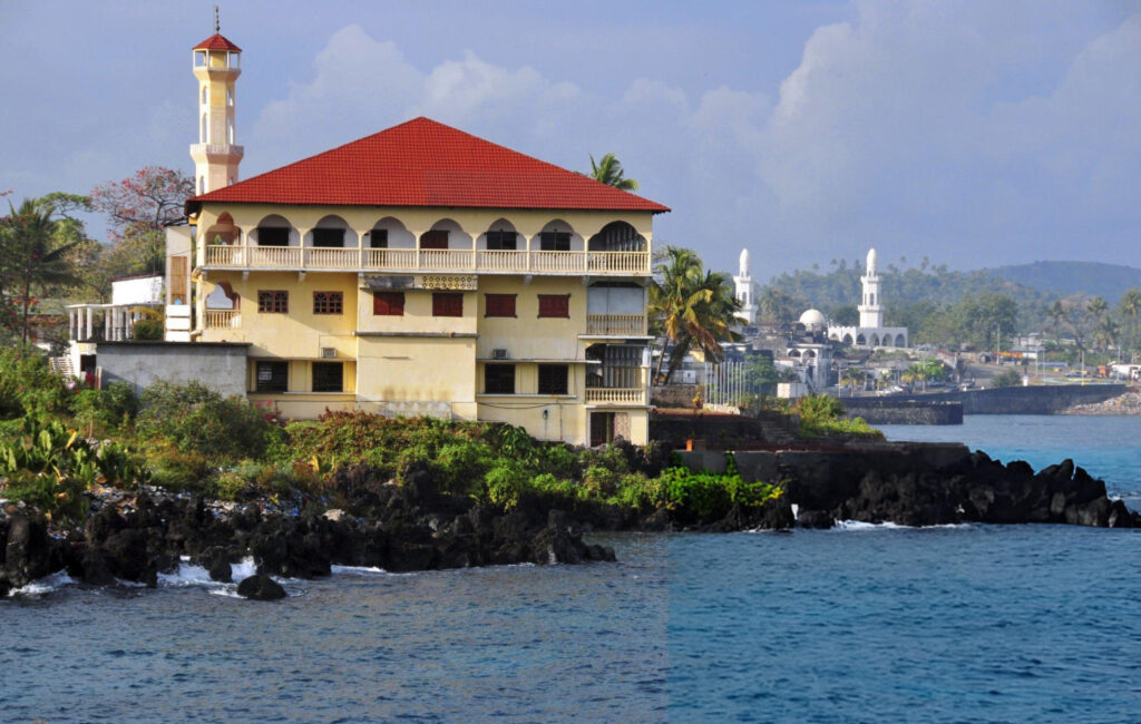Scenic view of Moroni, capital of Comoros, featuring the Moroni Cathedral, lush greenery, and the Indian Ocean