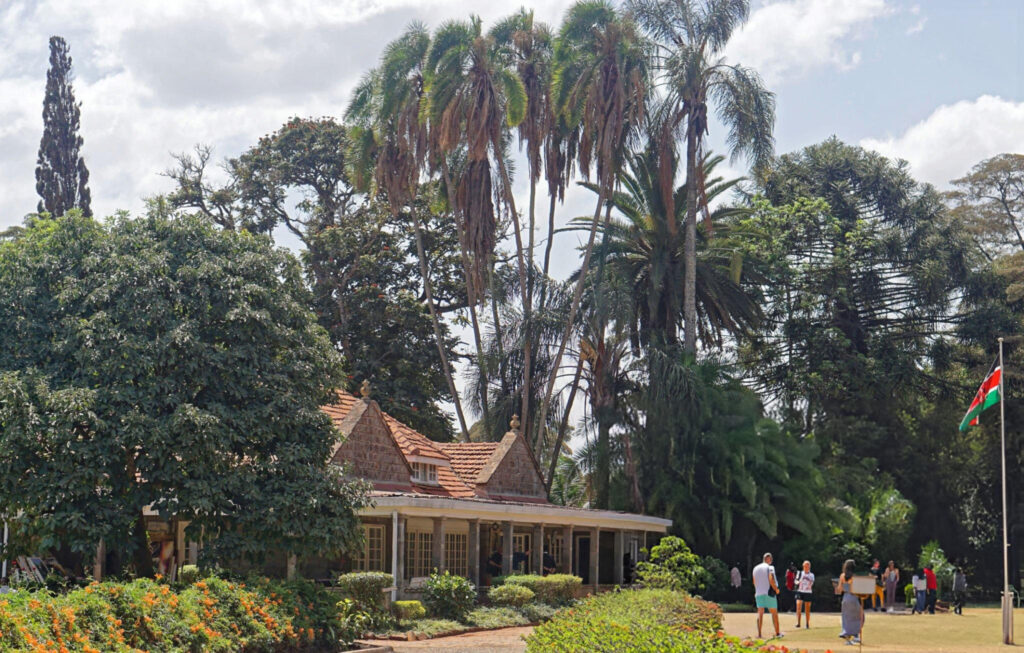 The front view of Karen Blixen Museum, surrounded by lush gardens and a peaceful atmosphere in Nairobi.