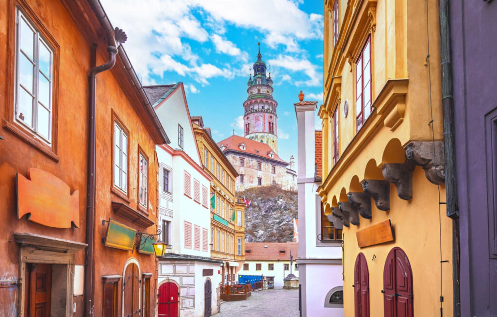 A row of vibrant, colorful buildings in Český Krumlov, Czech Republic, showcasing the town’s charming architecture and rich history.