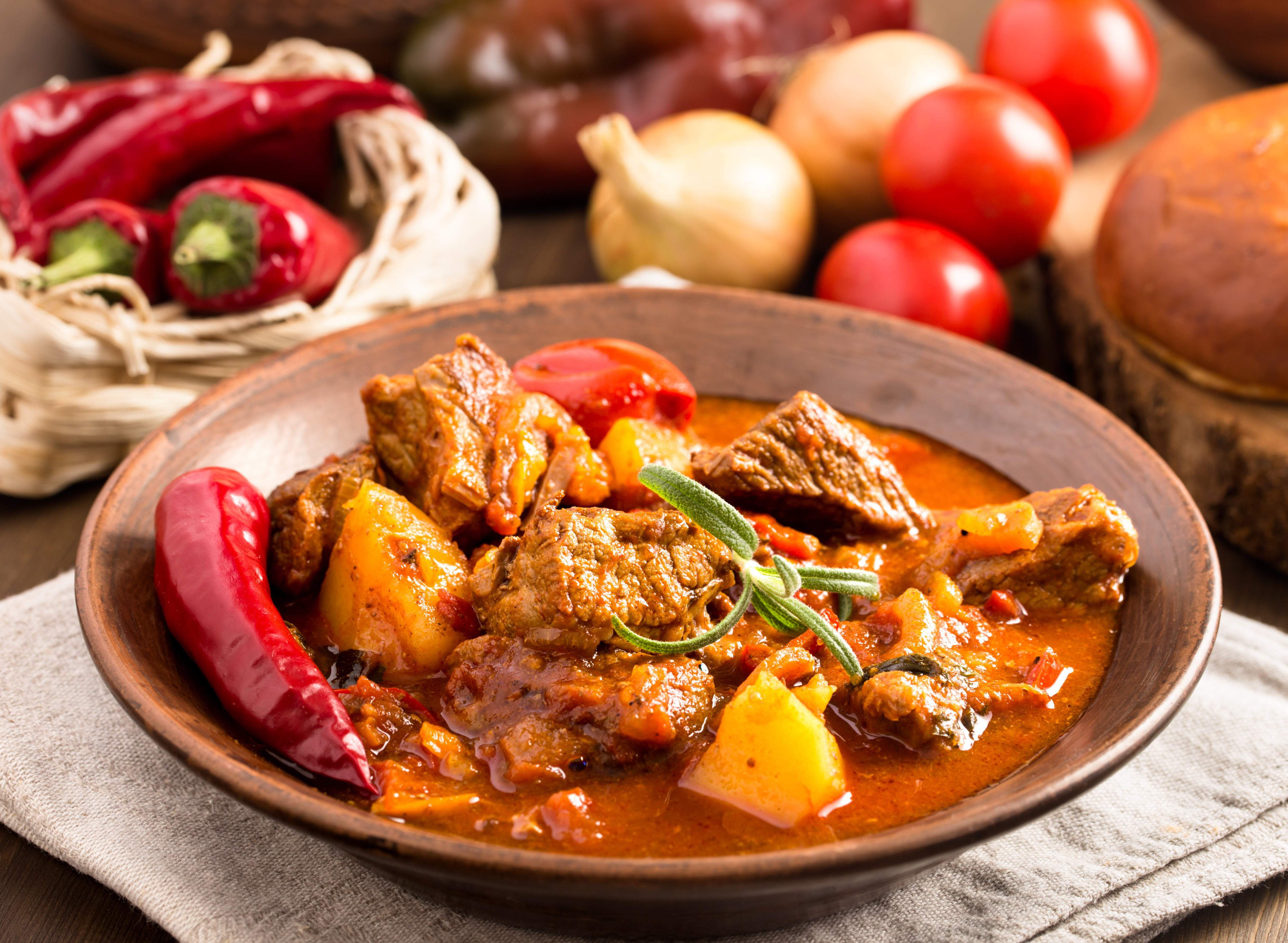 A selection of traditional Hungarian dishes including goulash, lángos, and chimney cake