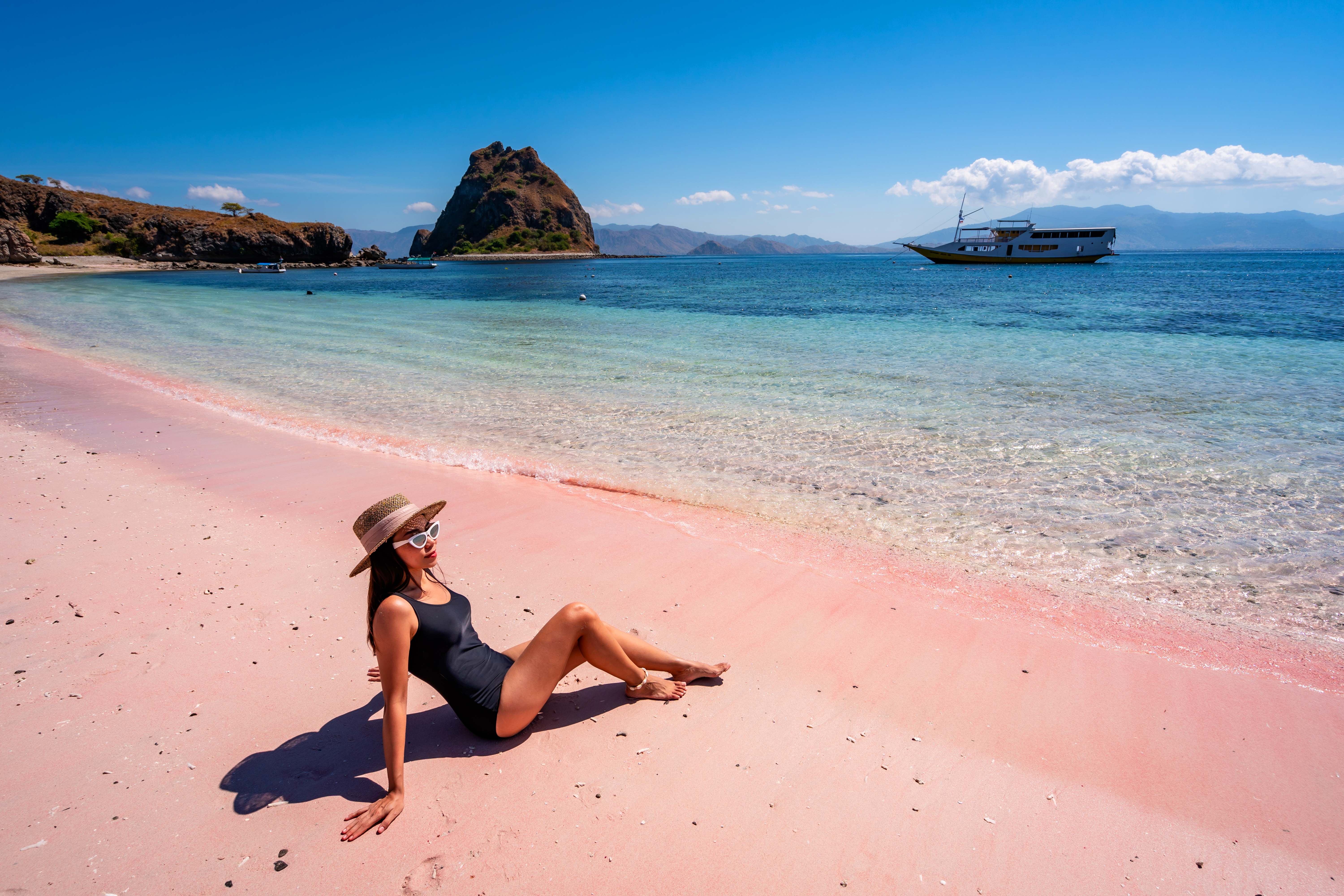 Komodo National Park Pink Beach on Komodo Island, Indonesia, featuring unique pink sand and turquoise waters against a scenic natural backdrop