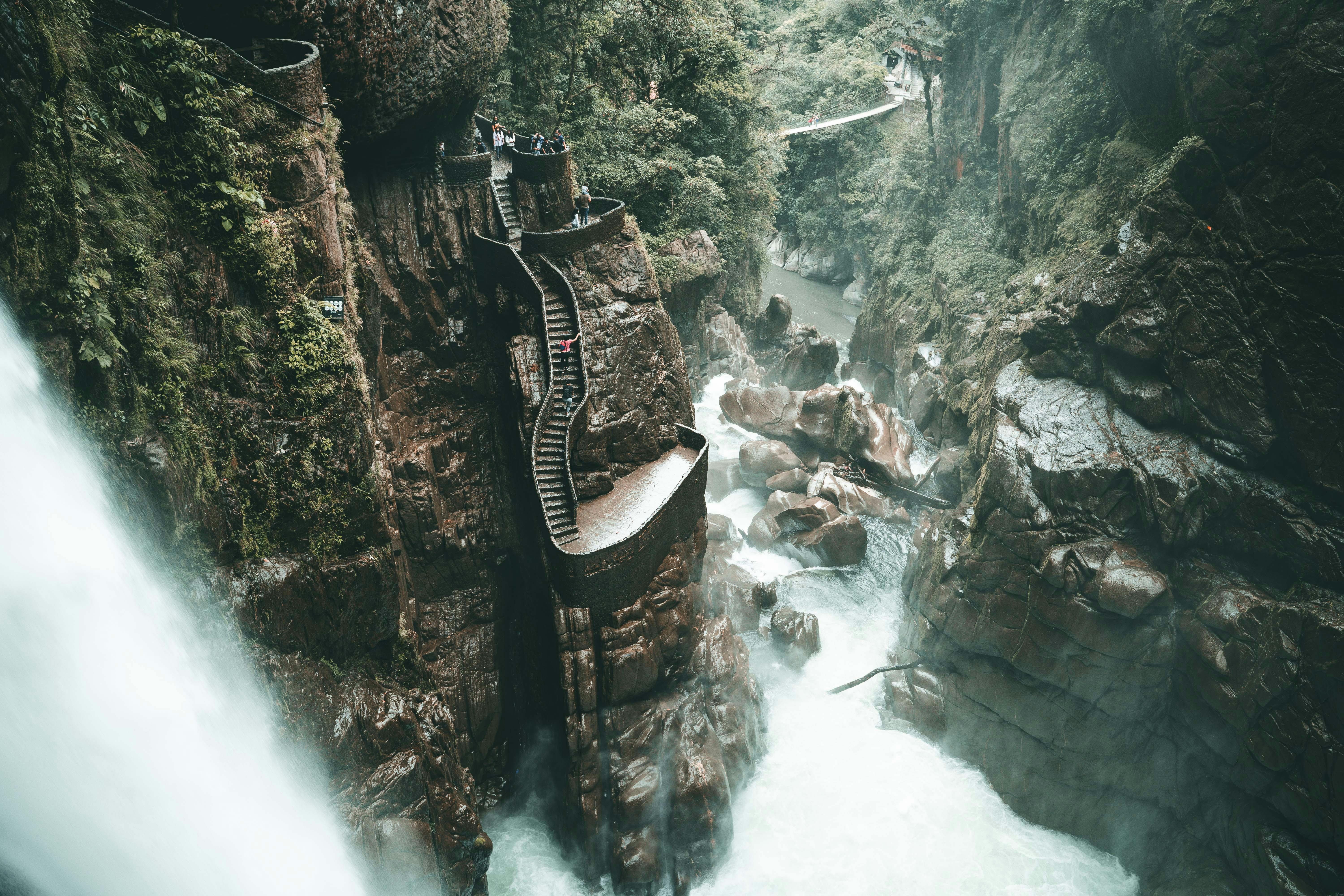 A powerful waterfall cascading down the rocks in Baños, Ecuador