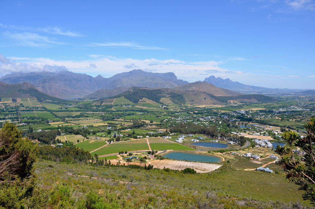 Franschhoek Valley with lush vineyards, mountain backdrop, and a scenic view in South Africa