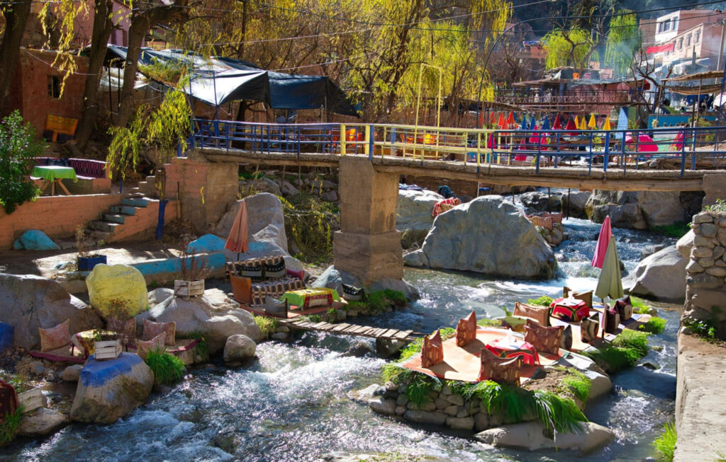 A cozy local restaurant in Dades Valley, Morocco, with traditional Moroccan decor and outdoor seating offering scenic mountain views